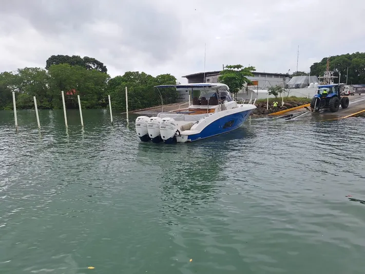 Jessica Yacht Photos Pics 2009 Sessa Marine Key Largo 36 boat with triple engines near a dock.