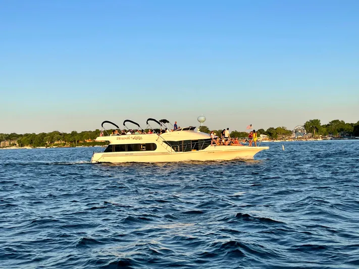  Yacht Photos Pics Bluewater Yachts 5200 Millennium 2000 cruising on a sunny day with passengers onboard.