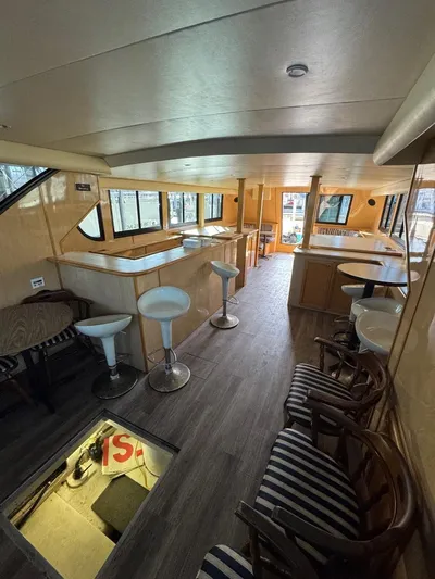  Yacht Photos Pics Interior of 2000 Bluewater Yachts 5200 Millenium with modern seating and wood finishes.