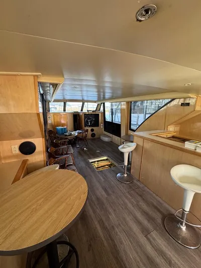  Yacht Photos Pics Interior of 2000 Bluewater Yachts 5200 Millenium with modern seating and wood accents.