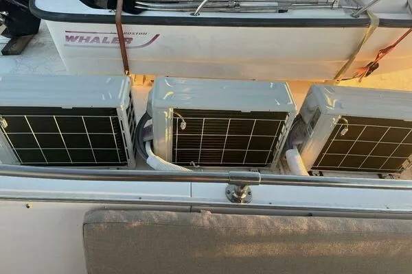 Still Pure Joy Yacht Photos Pics Three air conditioning units on a 1987 Hatteras 63 yacht deck.