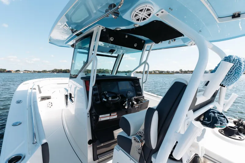 Lickety-split Yacht Photos Pics 2021 Blackfin 332 CC boat interior with modern helm and ocean view.