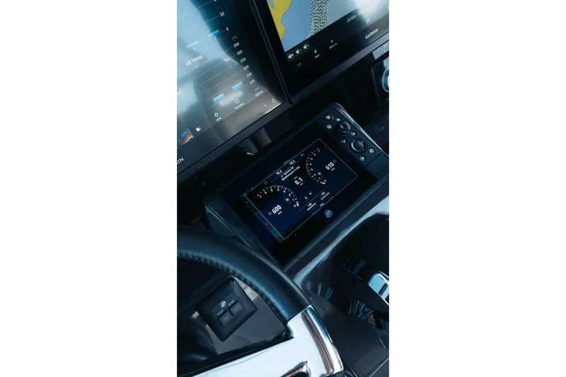Lickety-split Yacht Photos Pics 2021 Blackfin 332 CC dashboard with advanced navigation and control displays.