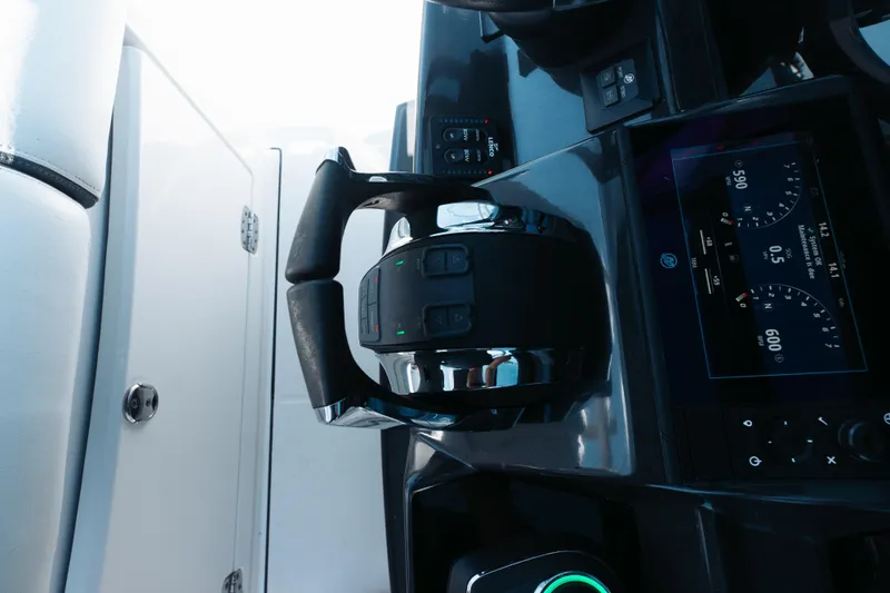 Lickety-split Yacht Photos Pics Control panel of 2021 Blackfin 332 CC boat with throttle and digital display.