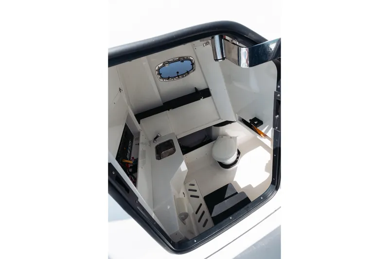 Lickety-split Yacht Photos Pics Interior of 2021 Blackfin 332 CC boat cabin with sink and toilet.