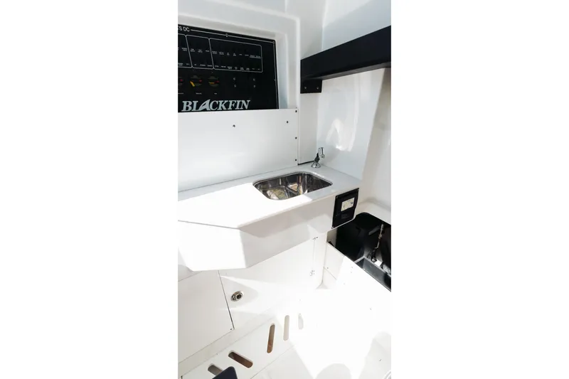 Lickety-split Yacht Photos Pics Interior view of 2021 Blackfin 332 CC boat featuring a compact sink area.
