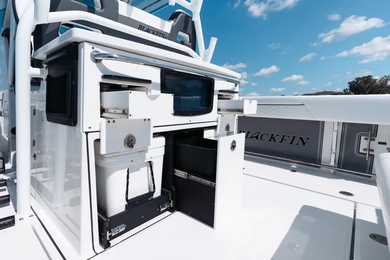 Lickety-split Yacht Photos Pics 2021 Blackfin 332 CC boat interior with storage compartments and seating.