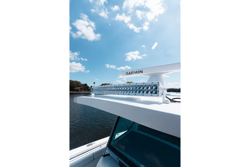 Lickety-split Yacht Photos Pics 2021 Blackfin 332 CC boat with Garmin equipment under a clear blue sky.