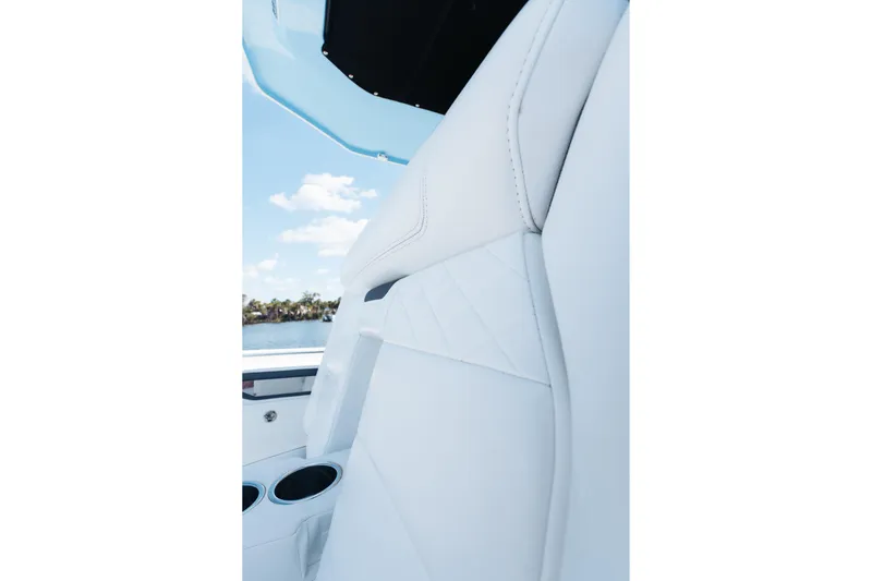 Lickety-split Yacht Photos Pics 2021 Blackfin 332 CC boat interior with white leather seating and cup holders.