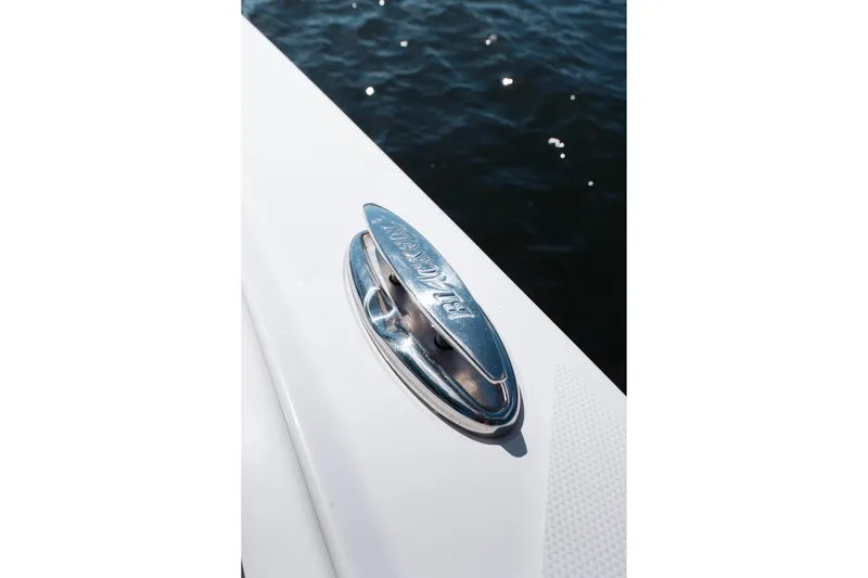Lickety-split Yacht Photos Pics 2021 Blackfin 332 CC boat cleat detail against water background.