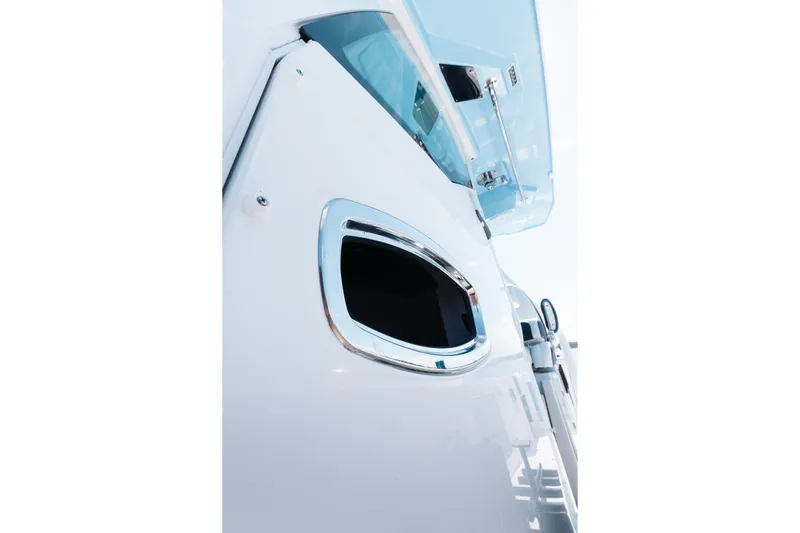 Lickety-split Yacht Photos Pics Close-up of 2021 Blackfin 332 CC boat window and sleek exterior design.