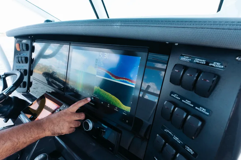 Lickety-split Yacht Photos Pics Dashboard of a 2021 Blackfin 332 CC boat with advanced navigation display.