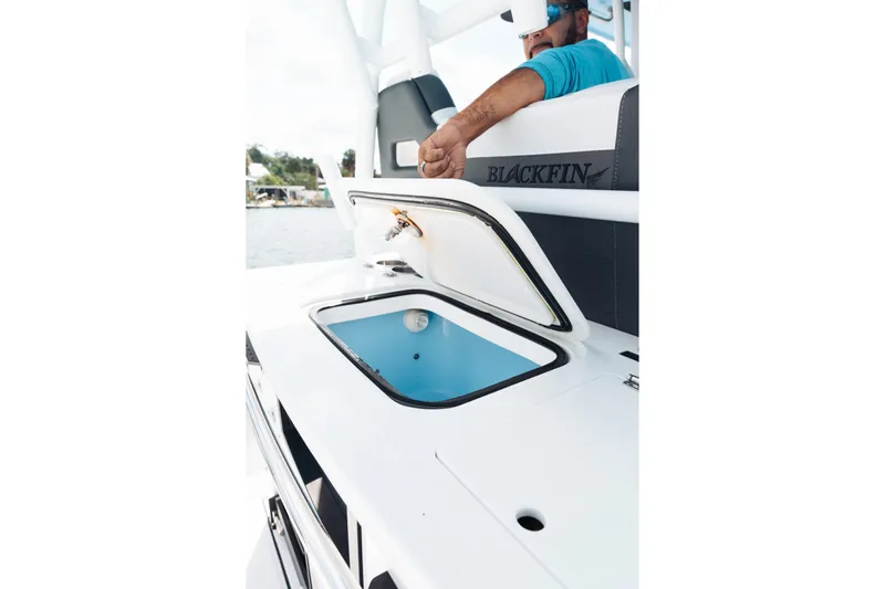 Lickety-split Yacht Photos Pics 2021 Blackfin 332 CC boat with open storage compartment, featuring sleek design and modern amenities.