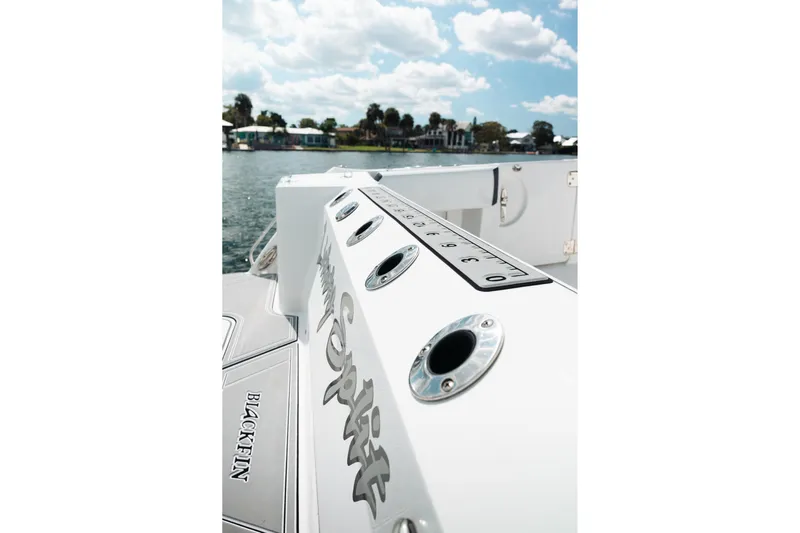 Lickety-split Yacht Photos Pics 2021 Blackfin 332 CC boat deck with rod holders and measurement guide.