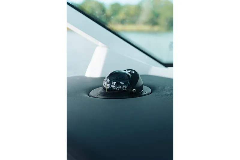 Lickety-split Yacht Photos Pics Compass on 2021 Blackfin 332 CC boat dashboard, close-up view.