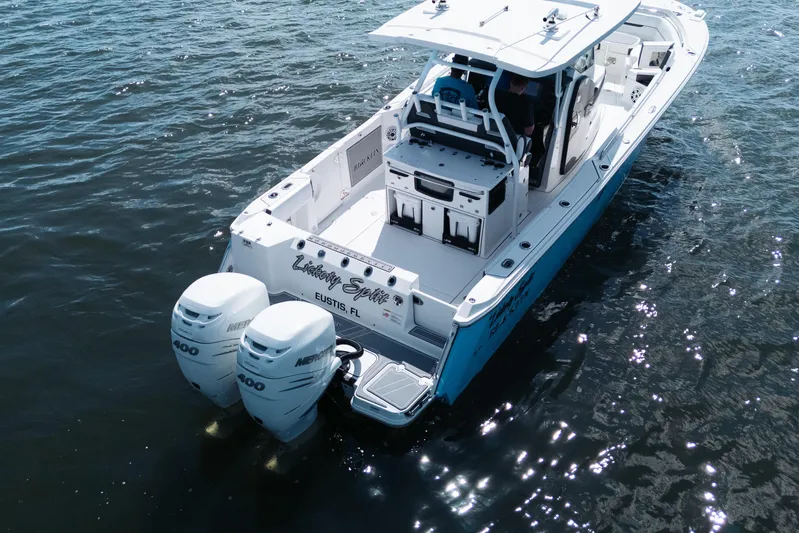Lickety-split Yacht Photos Pics 2021 Blackfin 332 CC boat with twin Mercury 400 engines on water.