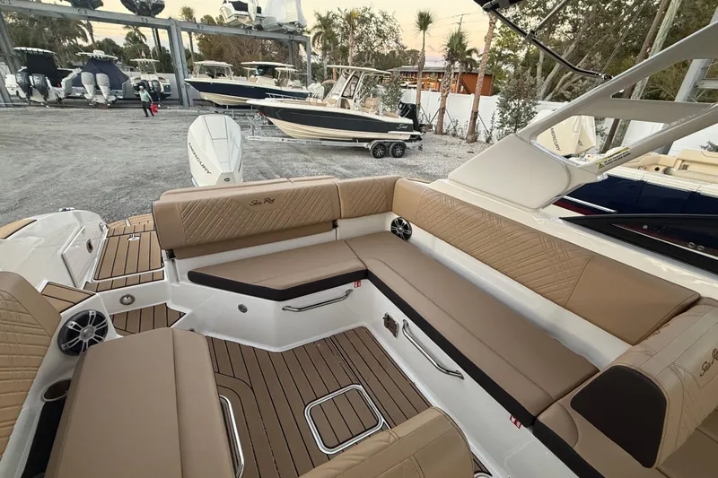  Yacht Photos Pics 2025 Sea Ray SDX 270 Outboard boat interior with tan seating and wood accents.
