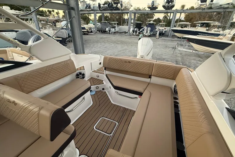  Yacht Photos Pics 2025 Sea Ray SDX 270 Outboard interior with tan seating and wood flooring.