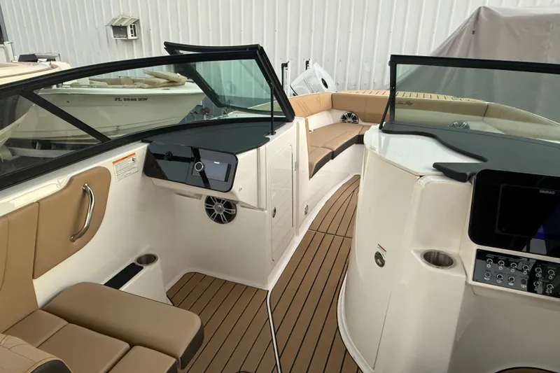  Yacht Photos Pics 2025 Sea Ray SDX 270 Outboard interior with tan seating and modern dashboard.