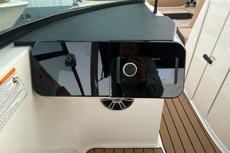  Yacht Photos Pics 2025 Sea Ray SDX 270 Outboard dashboard with Fusion audio system and teak flooring.
