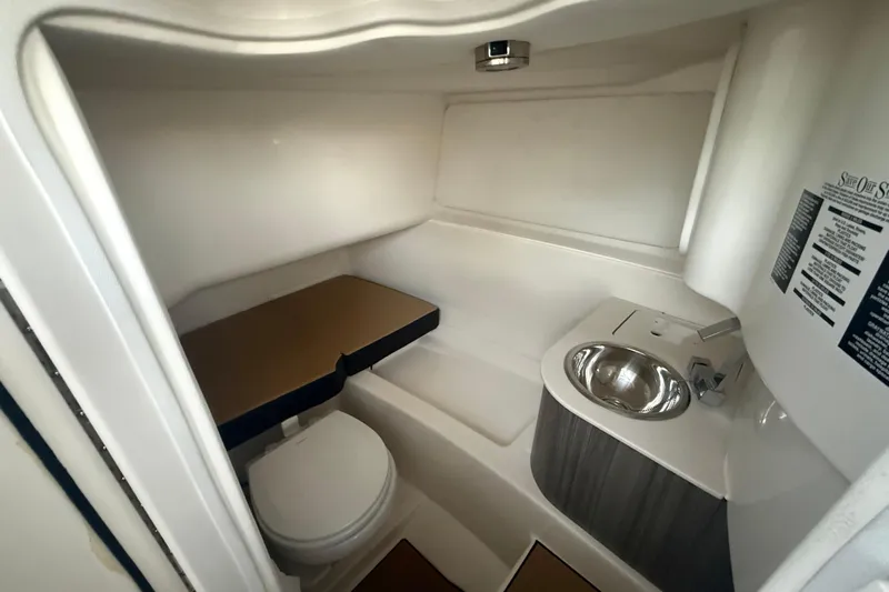  Yacht Photos Pics 2025 Sea Ray SDX 270 Outboard interior with toilet and sink.