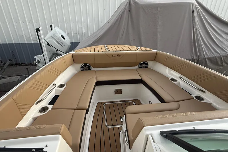  Yacht Photos Pics 2025 Sea Ray SDX 270 Outboard boat interior with tan seating and wood accents.