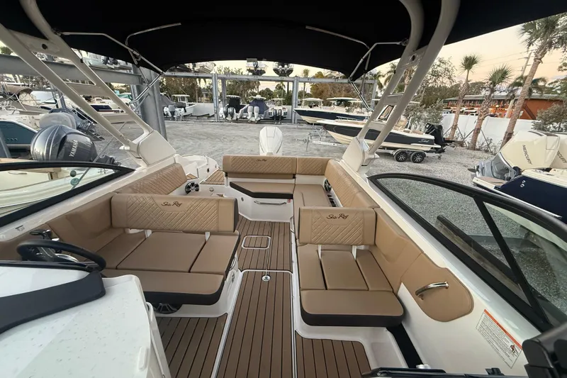 Yacht Photos Pics 2025 Sea Ray SDX 270 Outboard interior with tan seating and sleek design.