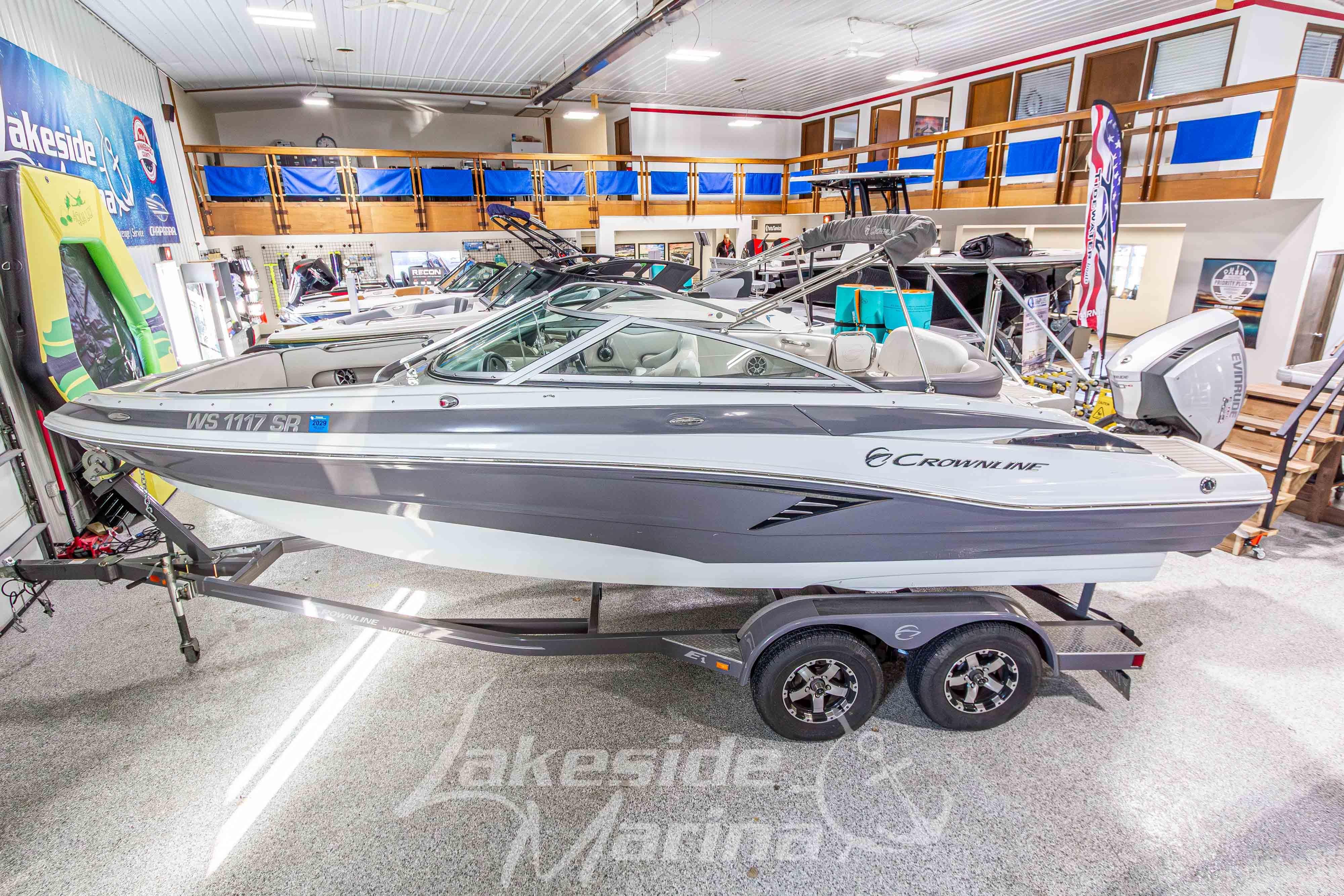 2017 Crownline Eclipse E1 XS boat displayed indoors on a trailer.