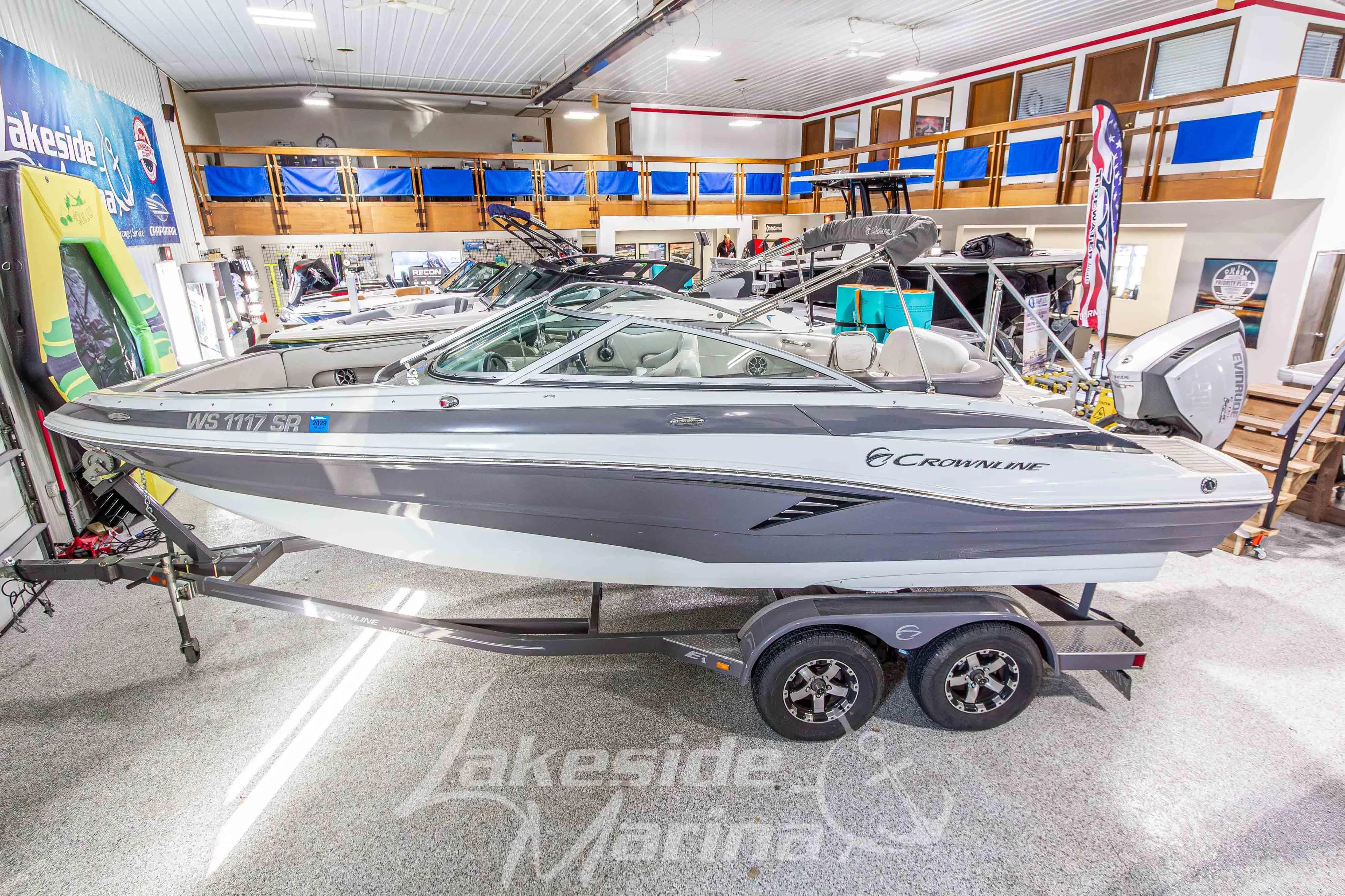 2017 Crownline Eclipse E1 XS boat displayed indoors on a trailer.