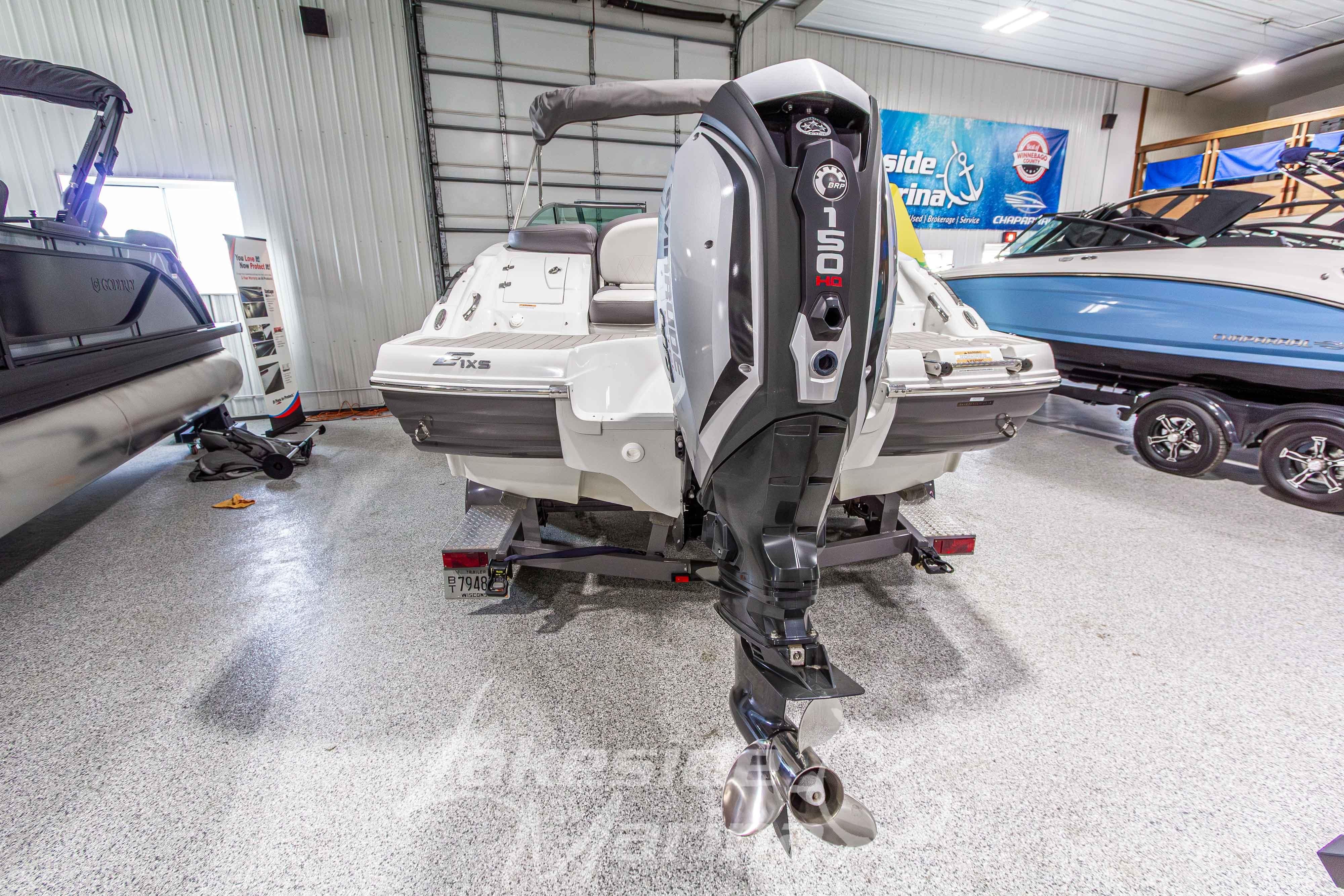 2017 Crownline Eclipse E1 XS boat with 150 HP outboard motor in showroom.