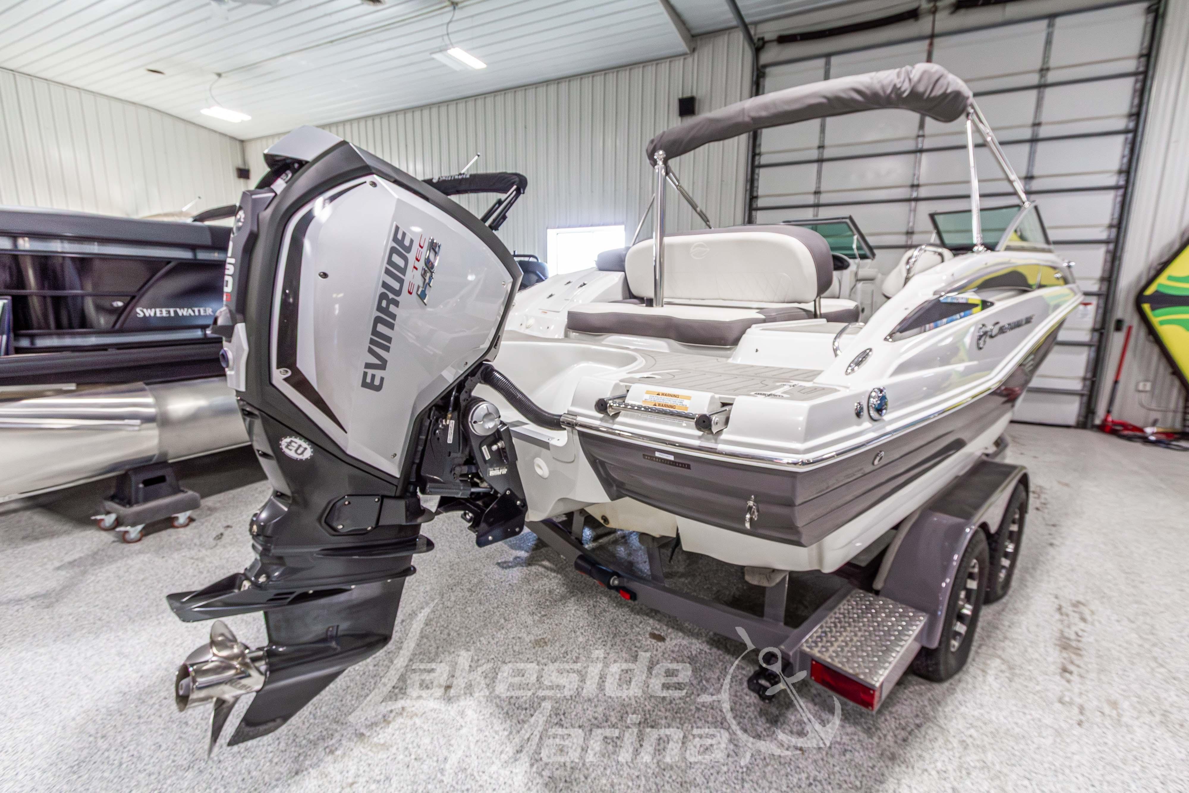 2017 Crownline Eclipse E1 XS boat with Evinrude engine in indoor showroom.