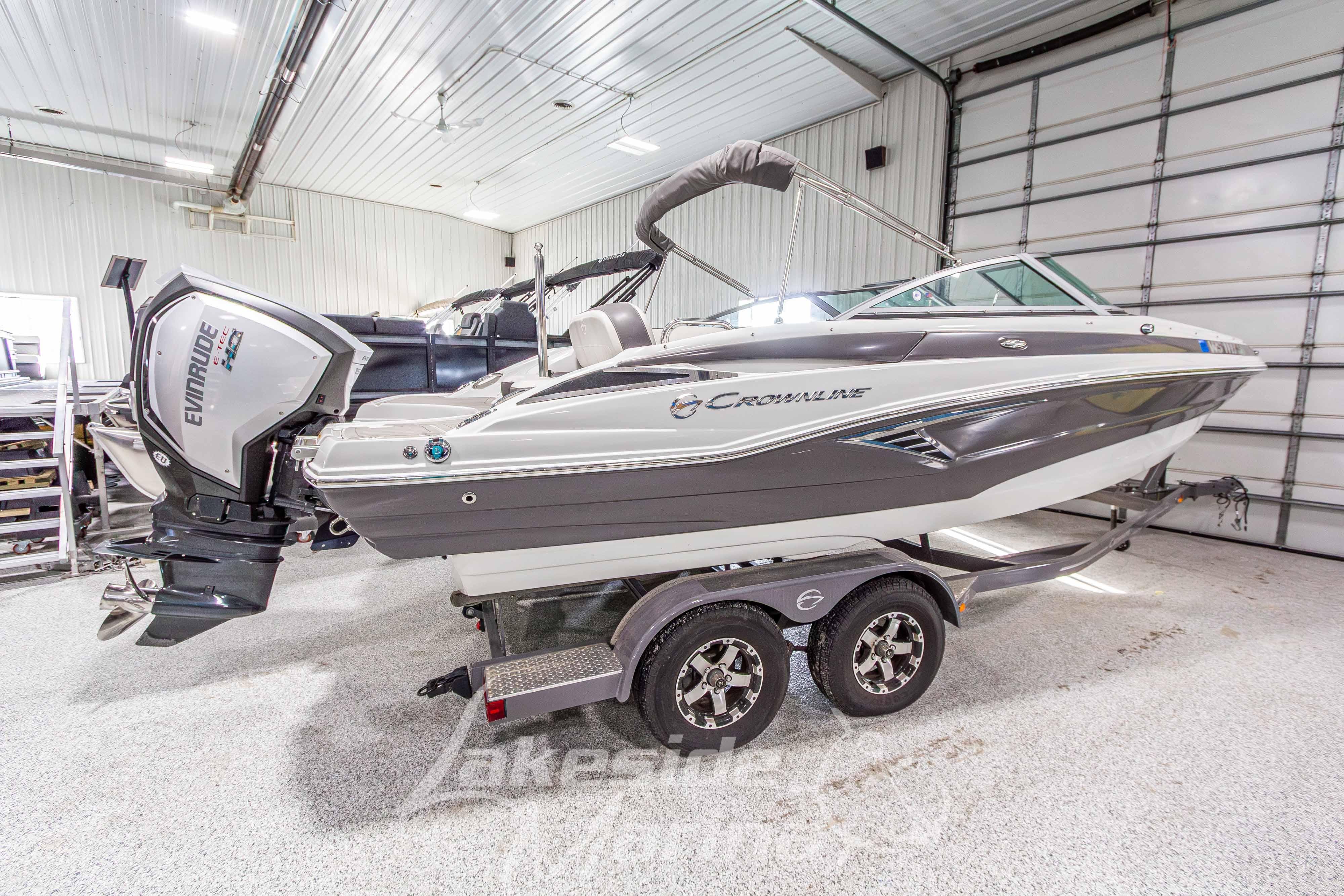 2017 Crownline Eclipse E1 XS boat in a garage, featuring an Evinrude outboard motor.