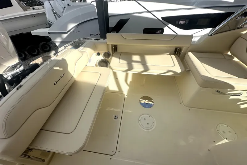  Yacht Photos Pics 2026 Chris-Craft Calypso 28 boat interior with beige seating and modern design.