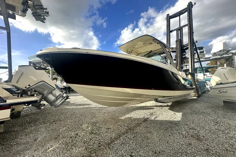  Yacht Photos Pics 2026 Chris-Craft Calypso 28 boat on display under a blue sky.