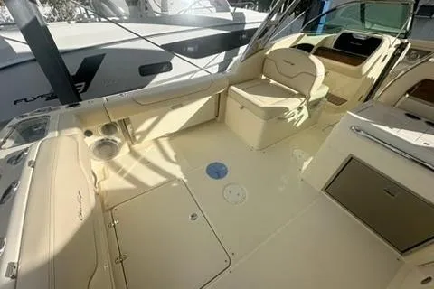  Yacht Photos Pics 2026 Chris-Craft Calypso 28 boat interior with seating and storage compartments.