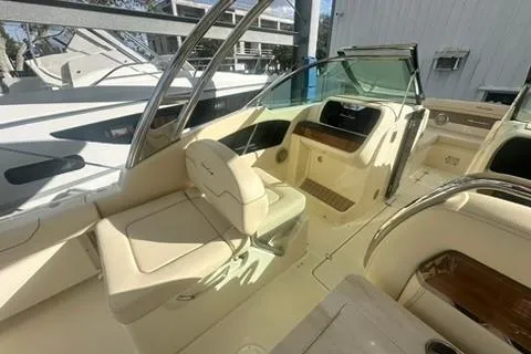  Yacht Photos Pics 2026 Chris-Craft Calypso 28 boat interior with luxurious seating and modern dashboard.