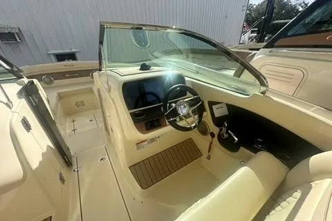  Yacht Photos Pics 2026 Chris-Craft Calypso 28 boat interior with steering wheel and dashboard.