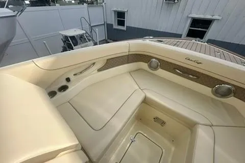  Yacht Photos Pics 2026 Chris-Craft Calypso 28 boat interior with beige seating and cup holders.