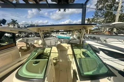  Yacht Photos Pics 2026 Chris-Craft Calypso 28 boat with open deck and seating, docked under a clear sky.