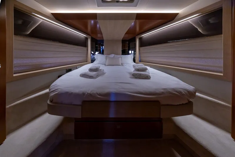 M/y Lioness Yacht Photos Pics Luxurious cabin interior of 2008 Baia Italia 70 yacht with cozy bed and ambient lighting.