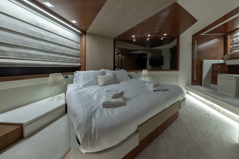 M/y Lioness Yacht Photos Pics Luxurious bedroom interior of 2008 Baia Italia 70 yacht with modern design and ambient lighting.