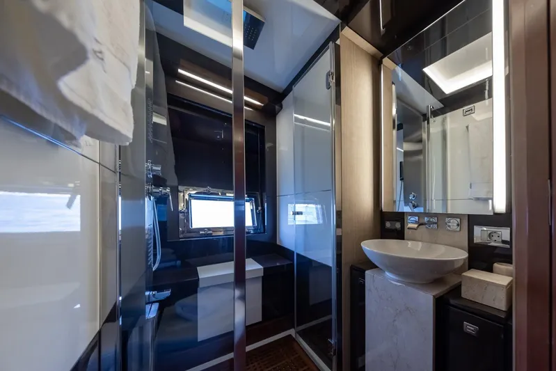 M/y Lioness Yacht Photos Pics Luxurious bathroom interior of 2008 Baia Italia 70 yacht with modern fixtures and elegant design.