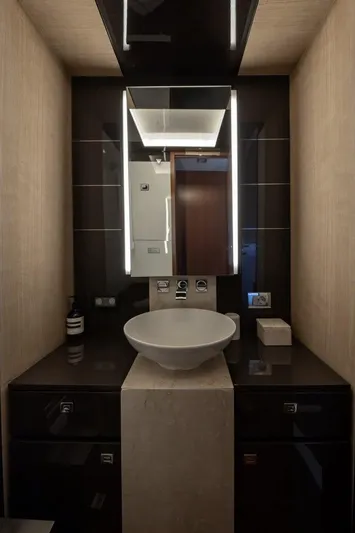 M/y Lioness Yacht Photos Pics Luxurious bathroom in 2008 Baia Italia 70 yacht with modern sink and mirror.