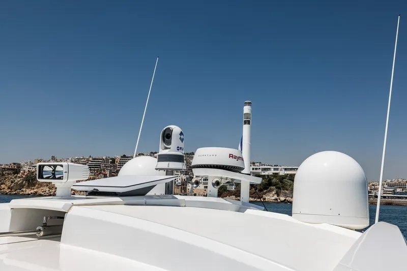 M/y Lioness Yacht Photos Pics Rooftop equipment on 2008 Baia Italia 70 yacht against clear blue sky.