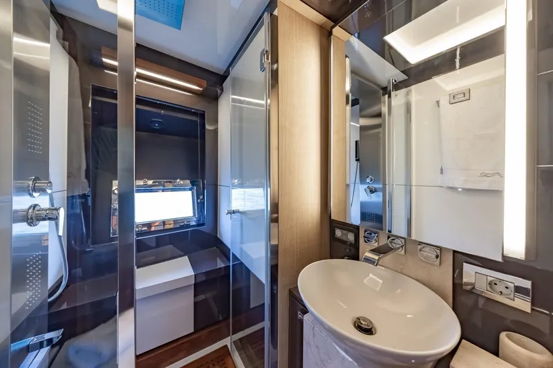 M/y Lioness Yacht Photos Pics Luxurious bathroom interior of 2008 Baia Italia 70 yacht, featuring modern fixtures and elegant design.