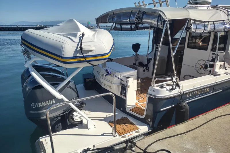 Wyvern Yacht Photos Pics 2020 Cutwater C-32 Coupe boat docked with Yamaha engines and inflatable dinghy.
