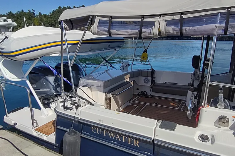 Wyvern Yacht Photos Pics 2020 Cutwater C-32 Coupe boat docked, featuring spacious deck and Yamaha engines.