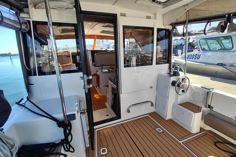 Wyvern Yacht Photos Pics 2020 Cutwater C-32 Coupe interior with teak flooring and modern design.