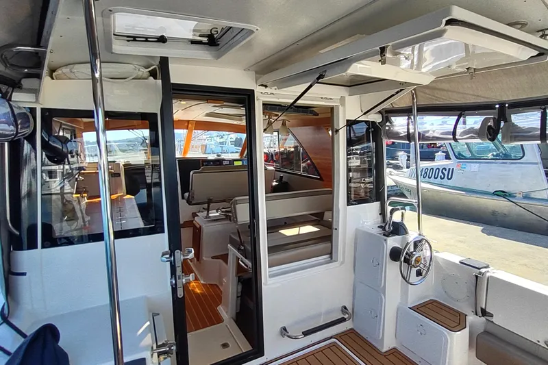 Wyvern Yacht Photos Pics Interior view of 2020 Cutwater C-32 Coupe boat, showcasing seating and helm area.