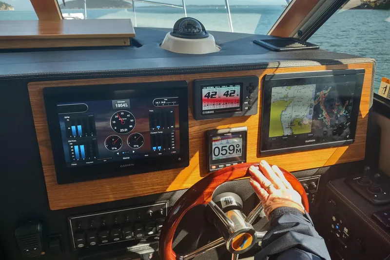 Wyvern Yacht Photos Pics 2020 Cutwater C-32 Coupe dashboard with Garmin navigation displays and steering wheel.